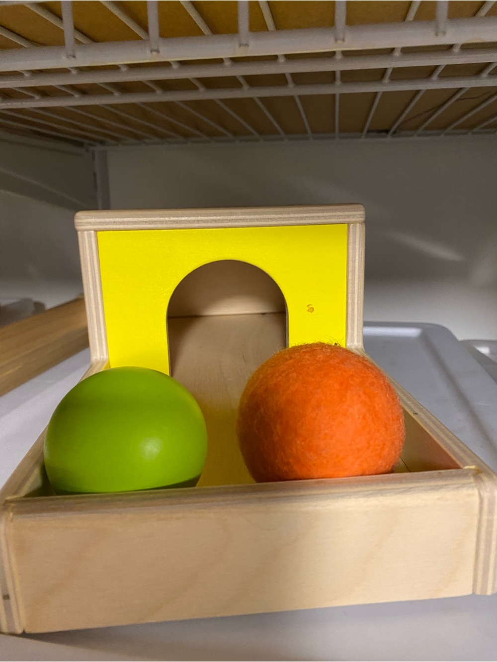 Lovevery Wooden Pop-Up Box Toy with Green and Orange Balls